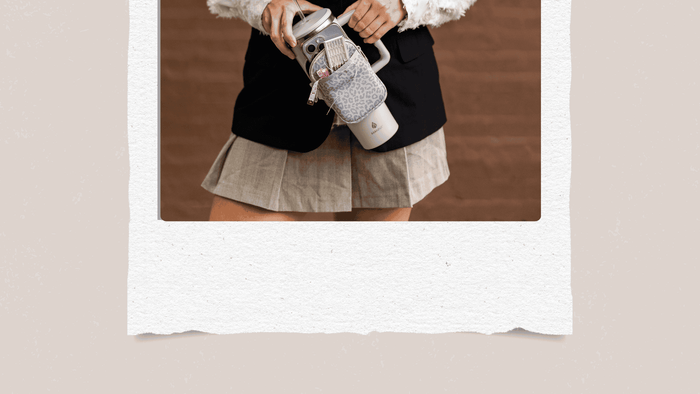 Girl in fashionable clothes holding a water bottle